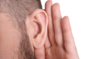 image of a homeowner listening to the heating oil tank alarm